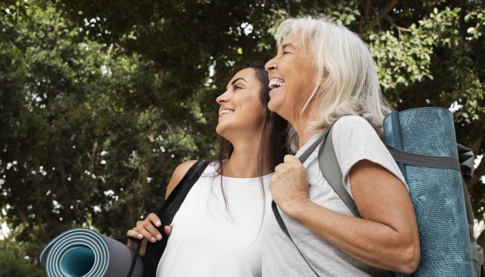 age-difference-female-friends-meeting-up-yoga-outdoors