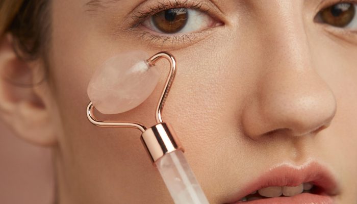 close-up-woman-using-face-tool