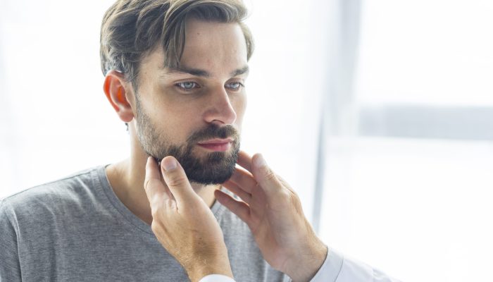 crop-doctor-touching-lymph-nodes-young-man