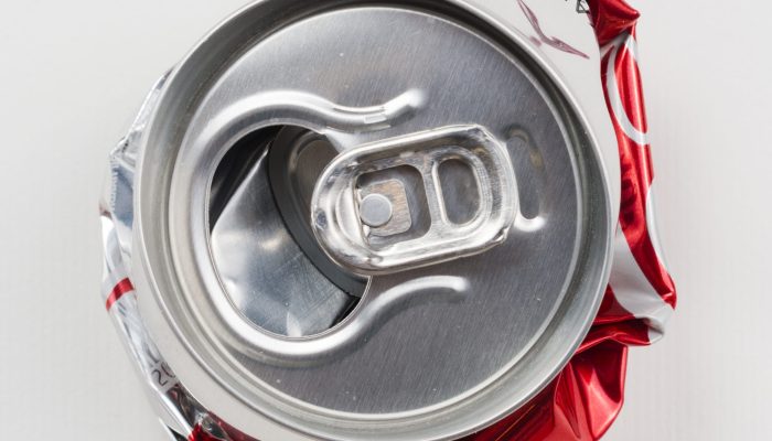crumpled-drink-can-grey-background