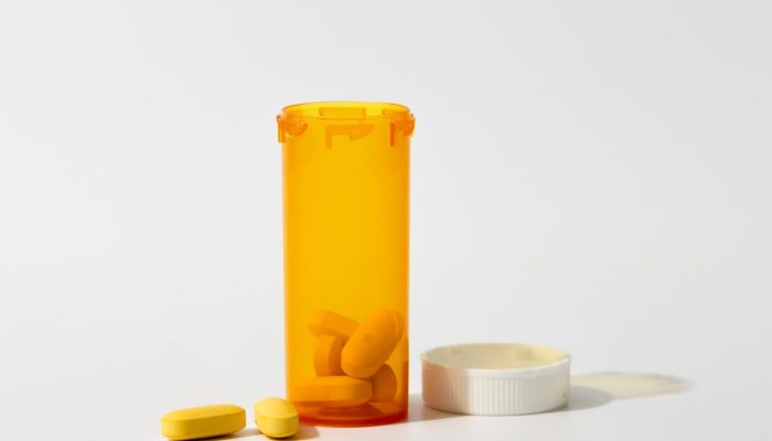 front-view-plastic-container-with-pills