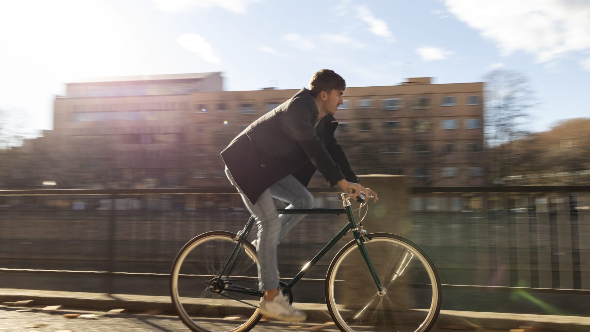 full-shot-man-riding-bicycle