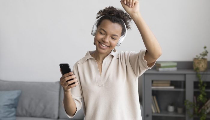 medium-shot-woman-listening-music