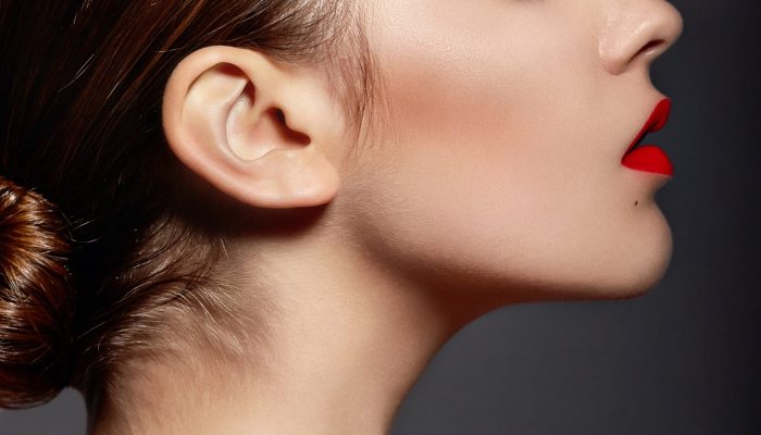 High fashion look.glamor closeup portrait of beautiful sexy stylish brunette Caucasian young woman model with bright makeup, with red lips,  with perfect clean skin in studio