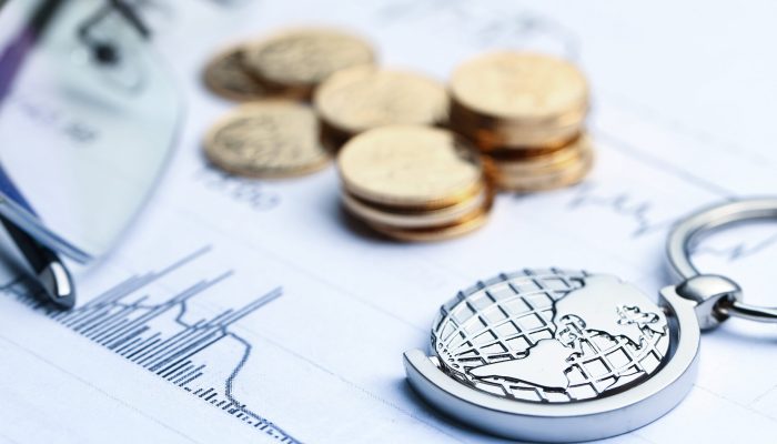 Coins, paper money and globe on white Statistic form background