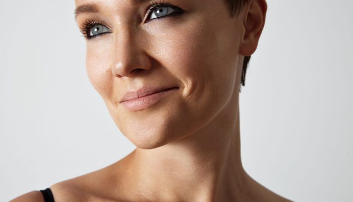 beauty young woman with a blue eyes and black smokey makeup