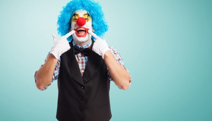 portrait of a funny clown over white