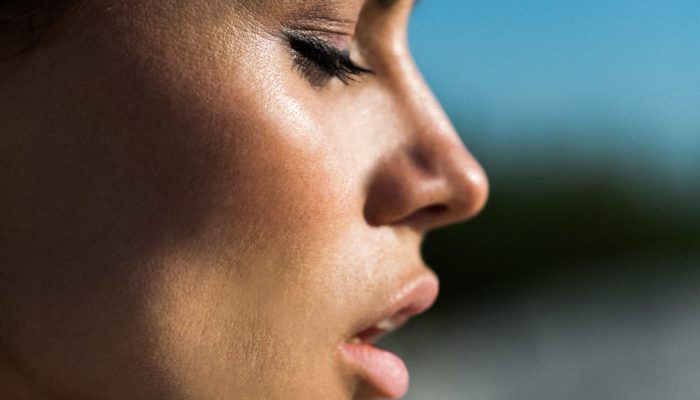 Profile of pretty woman with pink lips