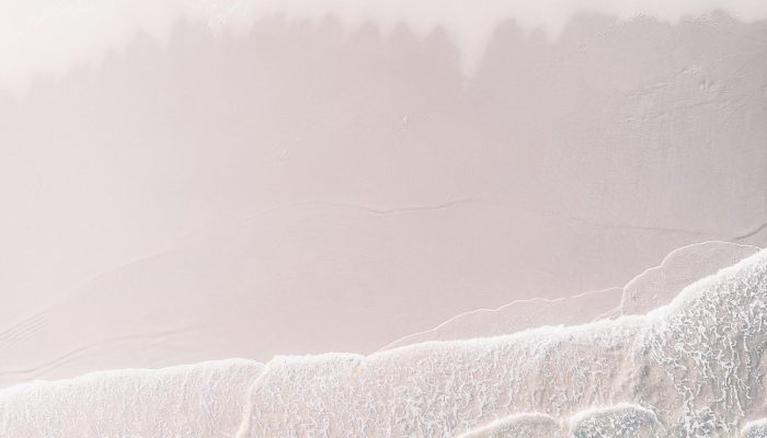 White sand beach mobile phone wallpaper drone shot