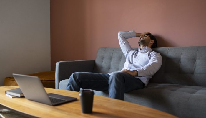 side-view-frustrated-man-couch