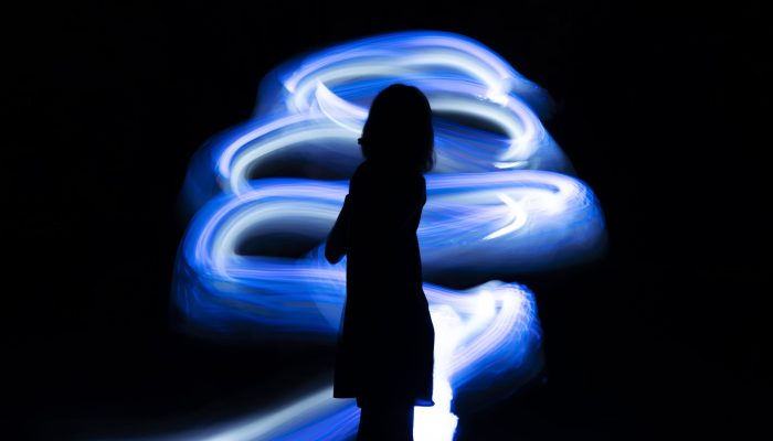 side-view-woman-posing-with-blue-light