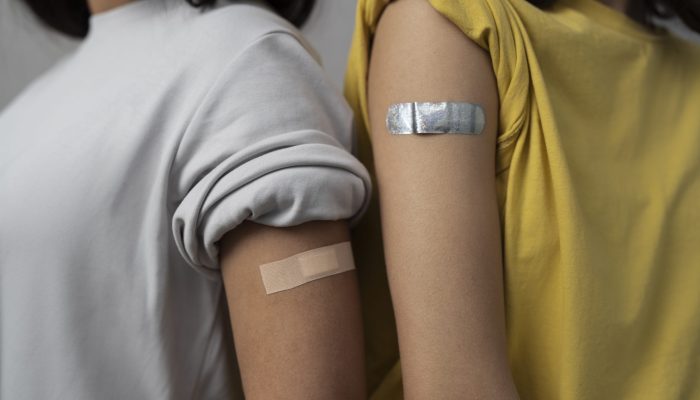 side-view-women-wearing-band-aids