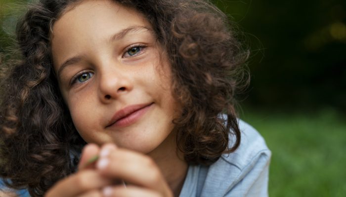 smiley-kid-outdoors-front-view