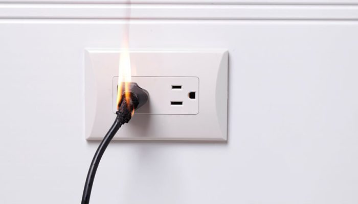 Electric plug on fire