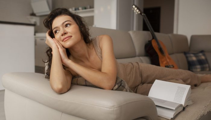 woman-digital-disconnecting-home-by-reading-book