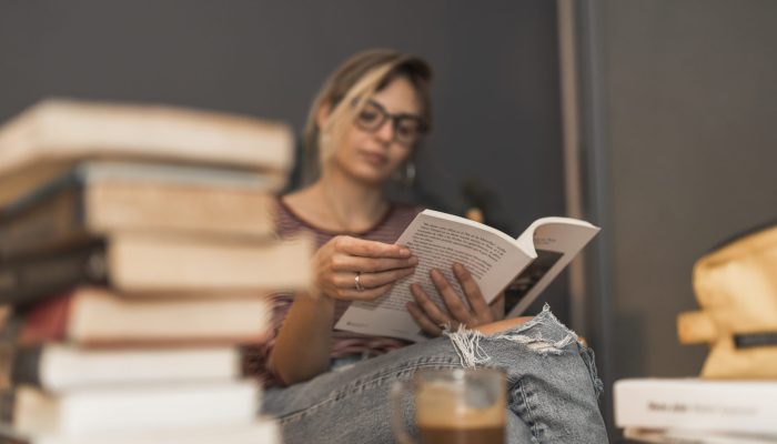 woman-reading-book-home