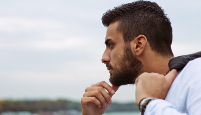Young handsome man looking at the city view.