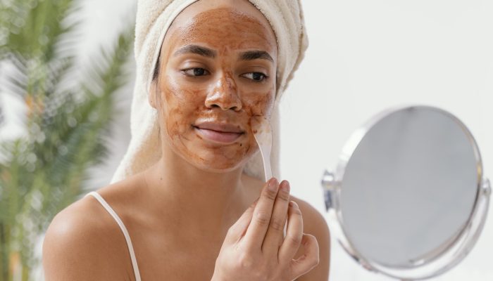 young-woman-applying-natural-face-mask